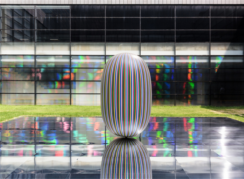 Kimsooja, Deductive Object. (2016)  Site specific installation consisting of painted welded steel, aluminum mirror panels. Sculpture: 2.45 x 1.50 m, Mirror: 10 x 10 m. Installation at Kimsooja – Archive of Mind at MMCA, Seoul, Photo  by Jeon Byung Cheol. Courtesy of MMCA, Hyundai Motor Co., Kukje Gallery, Seoul, and Kimsooja Studio. Image provided by Kukje Gallery.