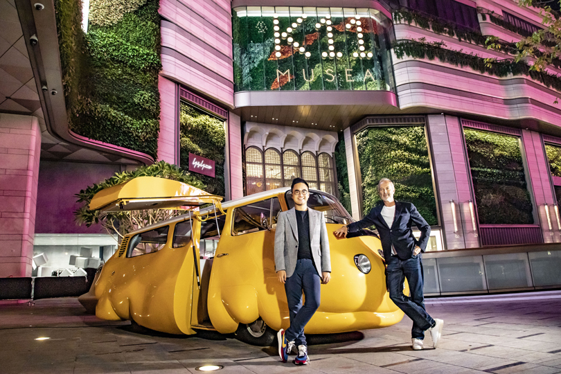 Adrian Cheng and Ervin Wurm in front of the Hot Dog Bus. Image Provided by K11